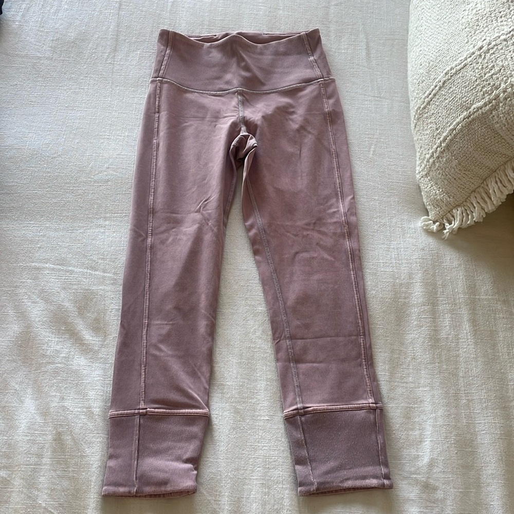 Size 4 Lululemon workout pants worn one time. Perfect condition and so cute!